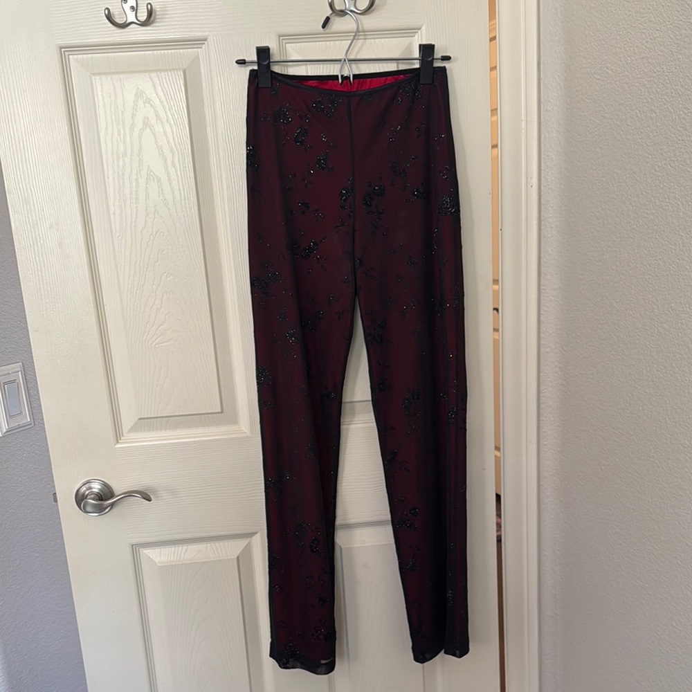 Women’s black sparkly stretchy pants with red back lining